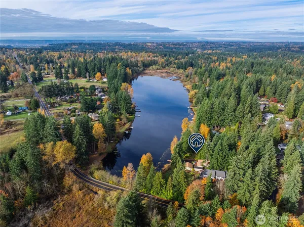 an aerial view of a houses with a yard