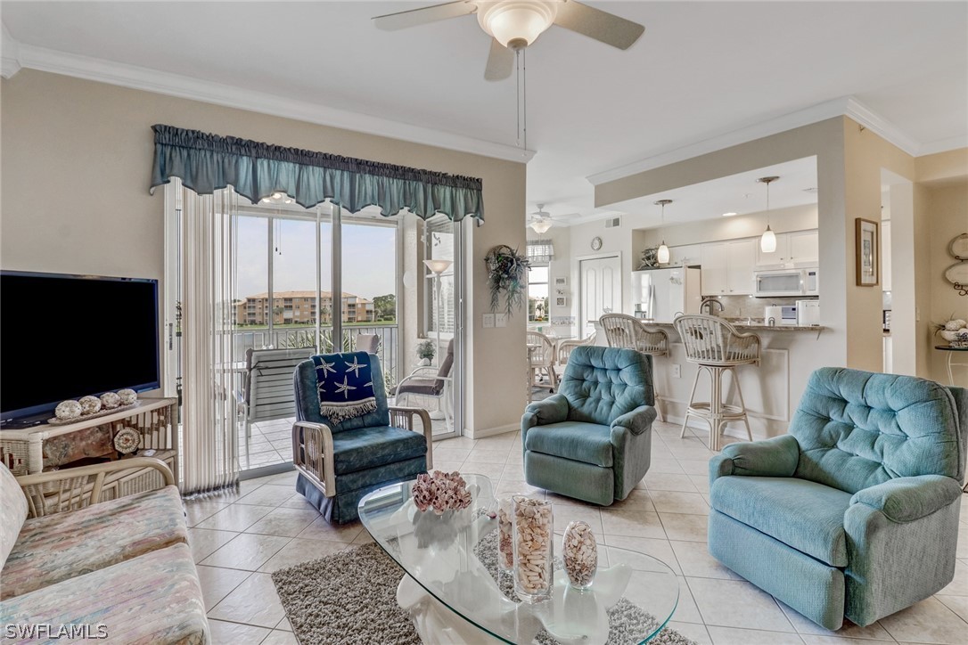 14101 Brant Point Circle, Unit 3303 Fort Myers, FL 33919 - Photo 11 of 30 a living room with furniture and a flat screen tv