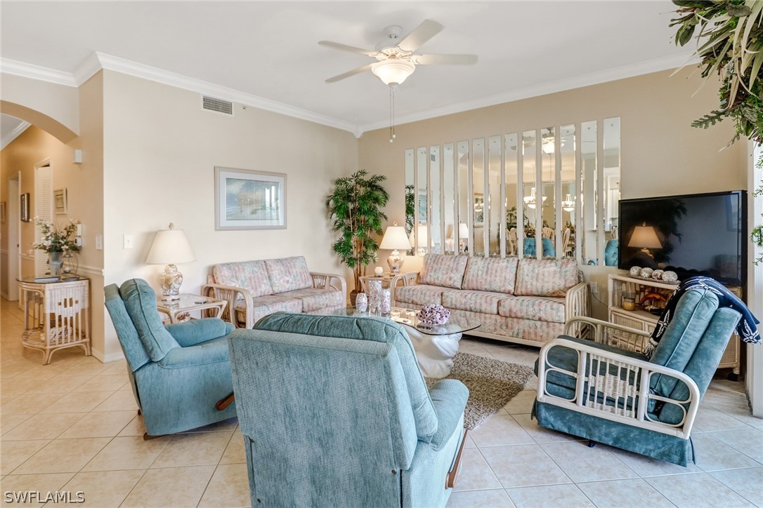 14101 Brant Point Circle, Unit 3303 Fort Myers, FL 33919 - Photo 12 of 30 a living room with furniture and a large window
