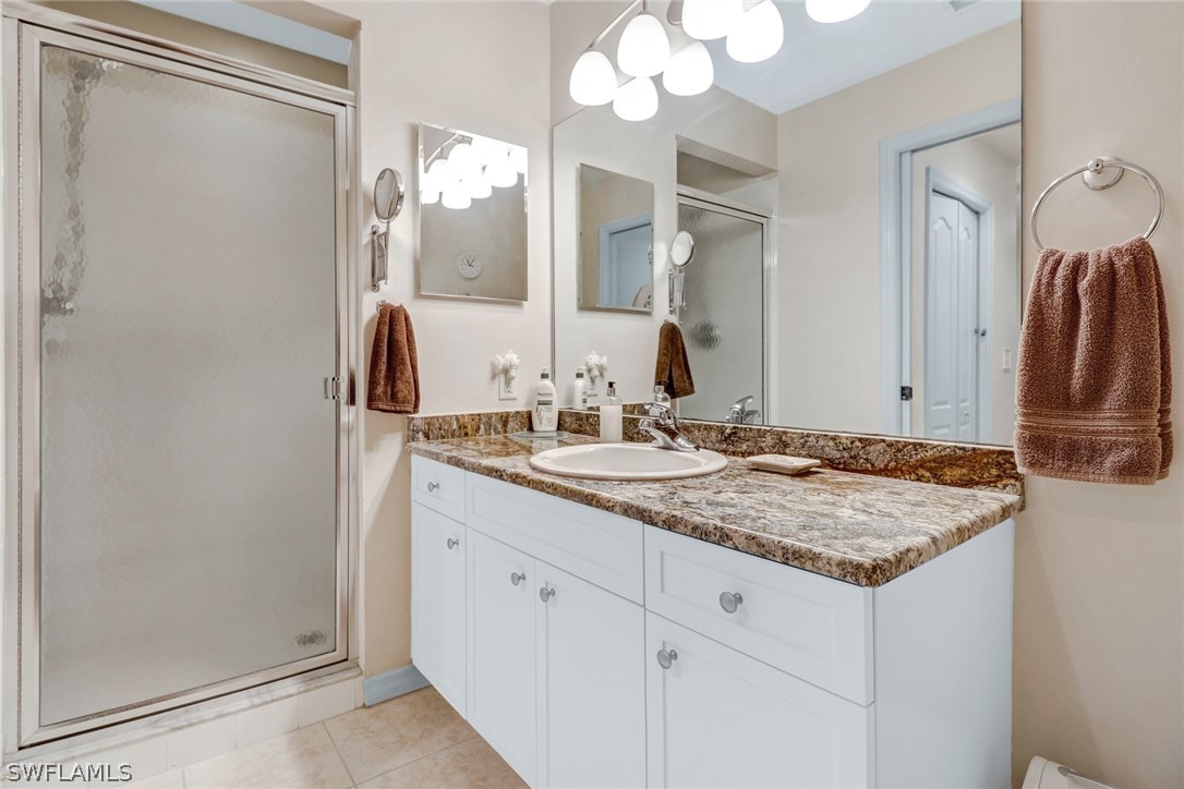 14101 Brant Point Circle, Unit 3303 Fort Myers, FL 33919 - Photo 13 of 30 a bathroom with a sink vanity and a mirror