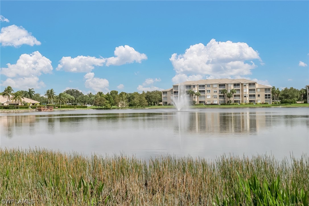 14101 Brant Point Circle, Unit 3303 Fort Myers, FL 33919 - Photo 21 of 30 a view of a lake with a building in the background