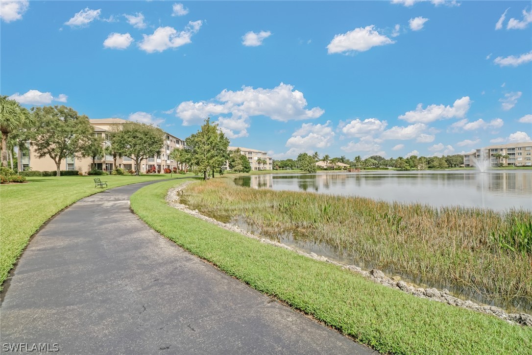 14101 Brant Point Circle, Unit 3303 Fort Myers, FL 33919 - Photo 22 of 30 a view of a lake with houses in the back