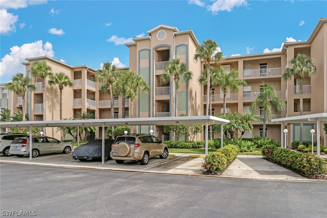 14101 Brant Point Circle, Unit 3303 Fort Myers, FL 33919 - Photo 23 of 30 a view of a building with car parked