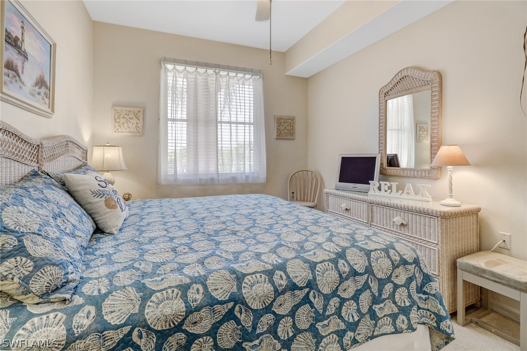 14101 Brant Point Circle, Unit 3303 Fort Myers, FL 33919 - Photo 8 of 30 a bedroom with a bed and a window