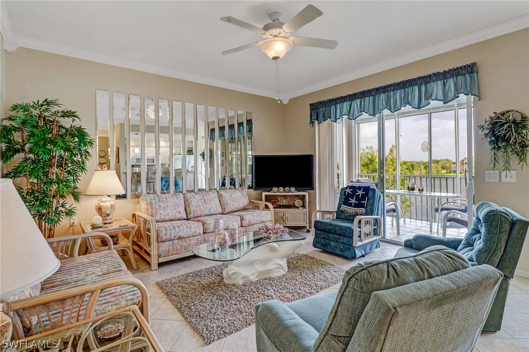 14101 Brant Point Circle, Unit 3303 Fort Myers, FL 33919 - Photo 10 of 30 a living room with furniture and a large window