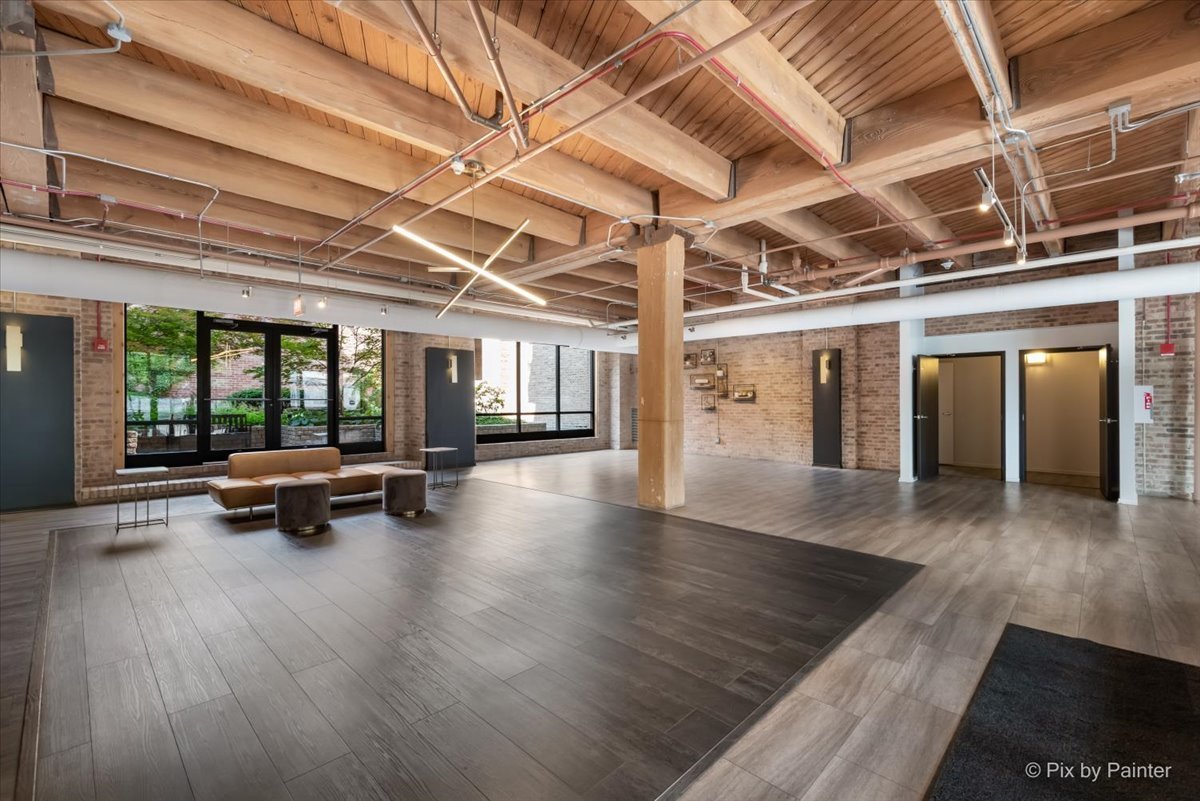 1040 West Adams Street, Unit 459 Chicago, IL 60607 - Photo 19 of 30 a view of a gym with wooden floor