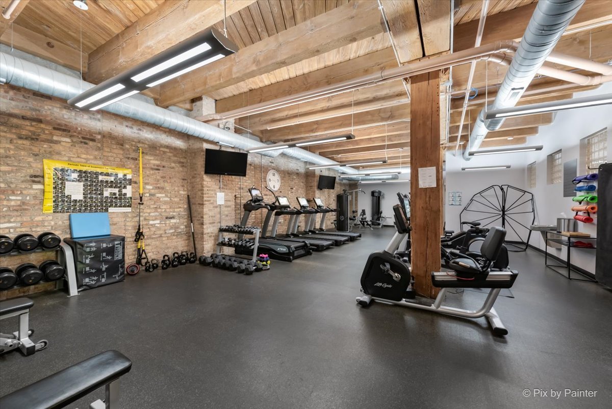 1040 West Adams Street, Unit 459 Chicago, IL 60607 - Photo 20 of 30 a view of a room with gym equipment