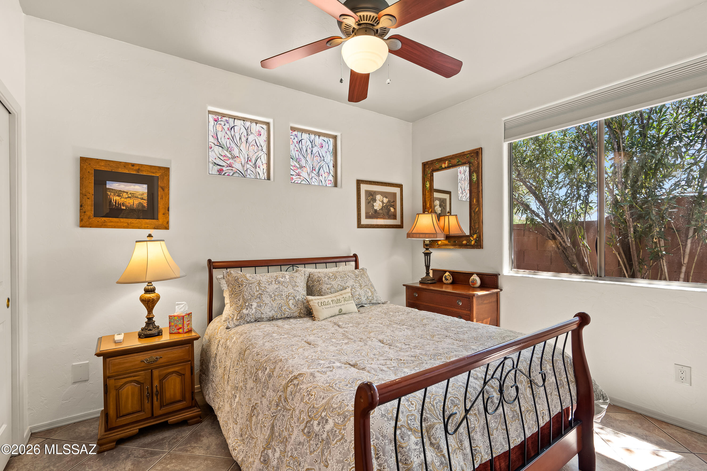 3396 North Camino Rio Colorado Tucson, AZ 85712 - Photo 18 of 32 a bedroom with a bed and a chandelier