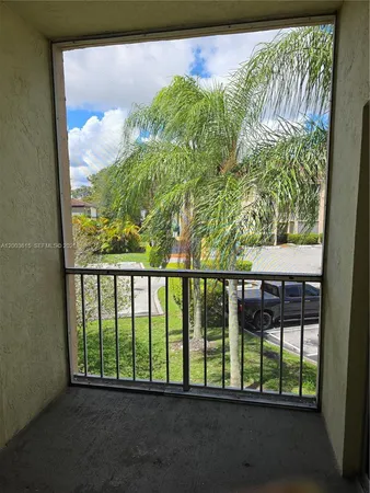 a view of empty room with floor to ceiling window