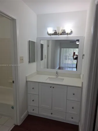 a bathroom with a bathtub and a toilet