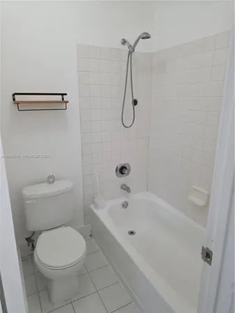 a bathroom with a sink vanity tub and mirror