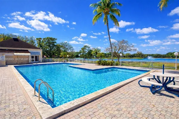 swimming pool with an outdoor seating
