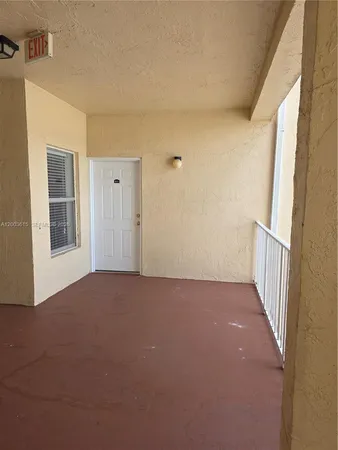 a room with wooden floor and a chair
