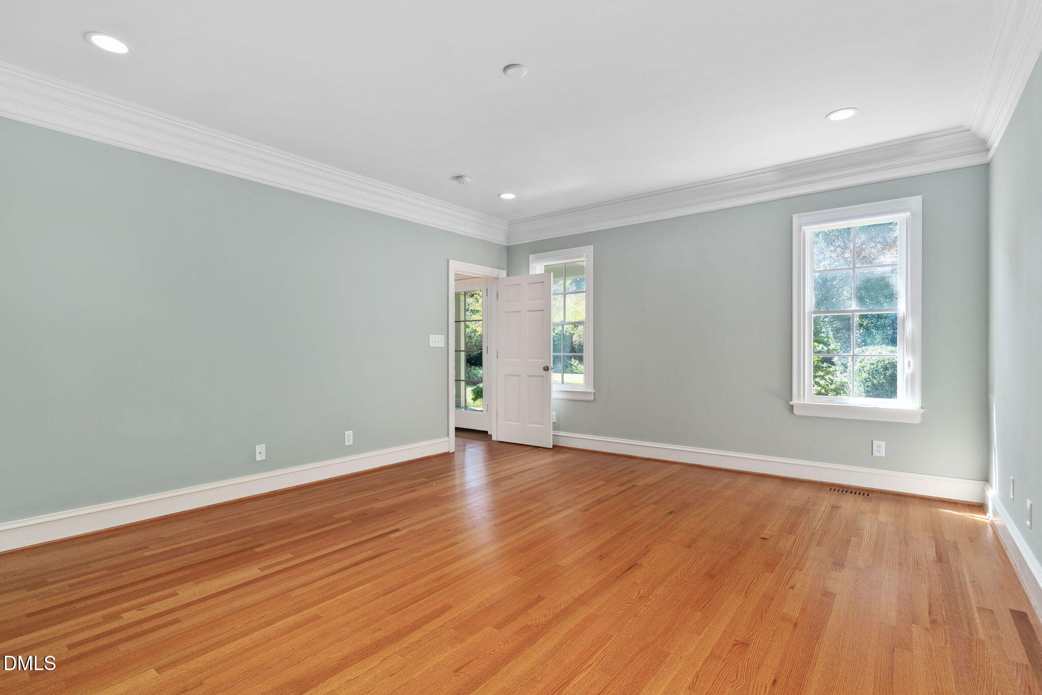 1505 Chester Road Raleigh, NC 27608 - Photo 54 of 80 a view of an empty room with wooden floor and a window