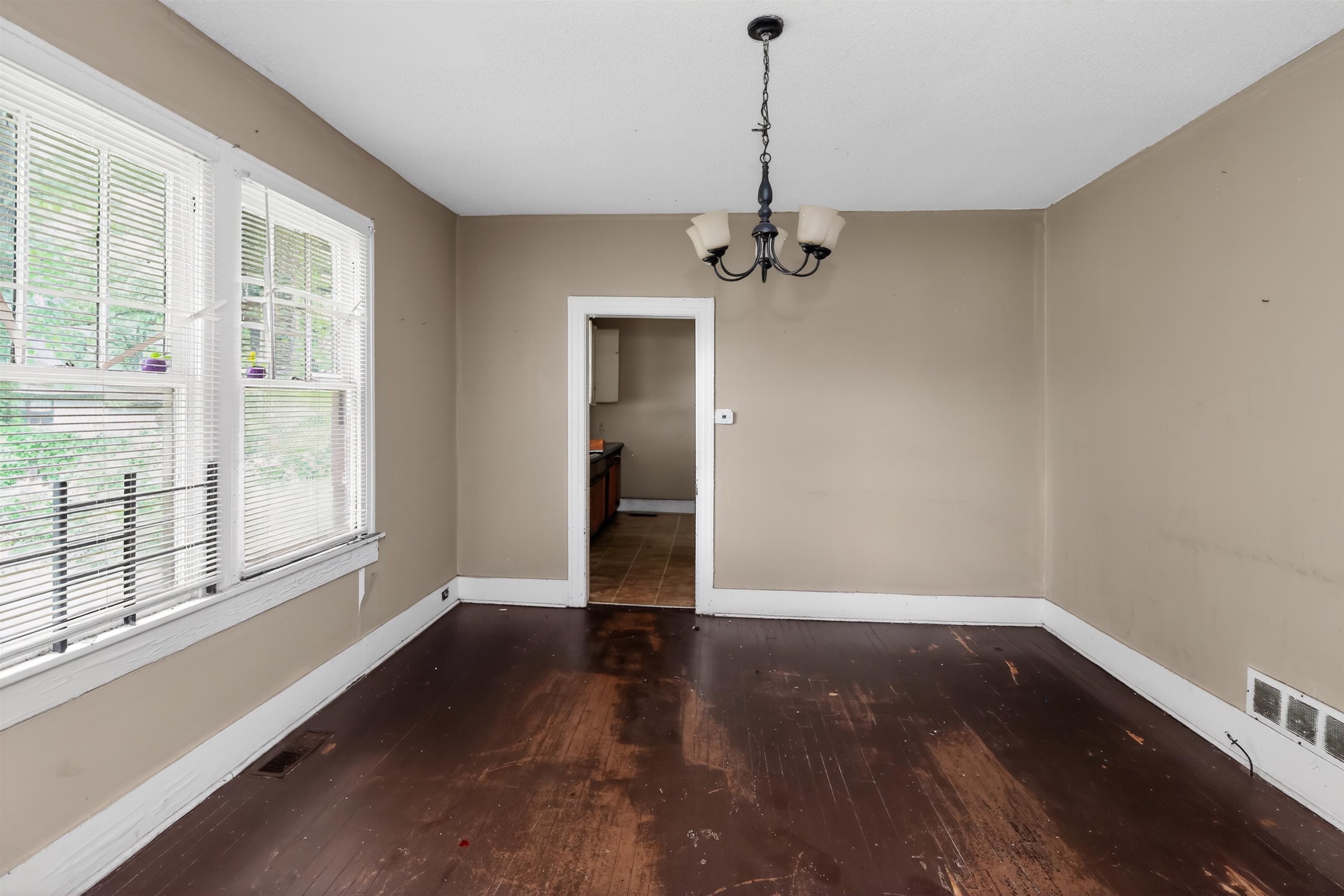 810 Hale Road Memphis, TN 38116 - Photo 17 of 30 Interior room featuring dark wood-finish flooring, light tan painted walls, and white trim