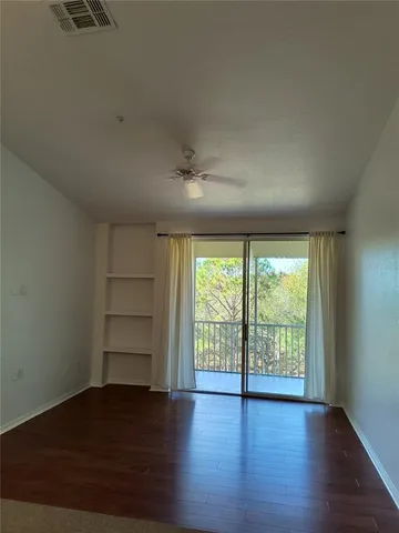 a view of a livingroom with wooden floor
