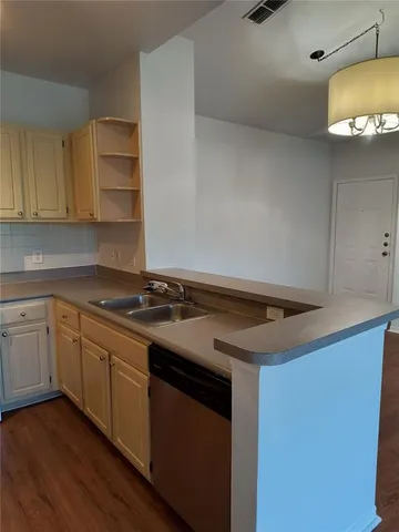 a kitchen with a stove and a sink