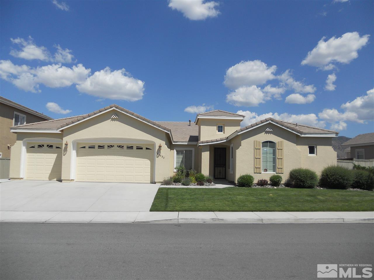 10530 Kenai Drive Reno, NV 89521 - Photo 1 of 1 a view of a white house with a big yard and large trees