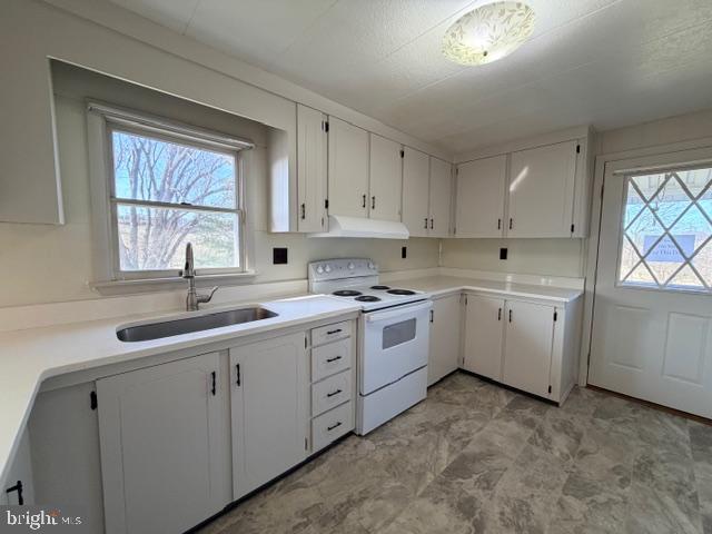 190 Bachmans Valley Road Westminster, MD 21158 - Photo 13 of 33 a kitchen that has a sink and a stove in it