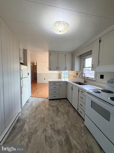 190 Bachmans Valley Road Westminster, MD 21158 - Photo 16 of 33 a kitchen with a stove a sink and a refrigerator