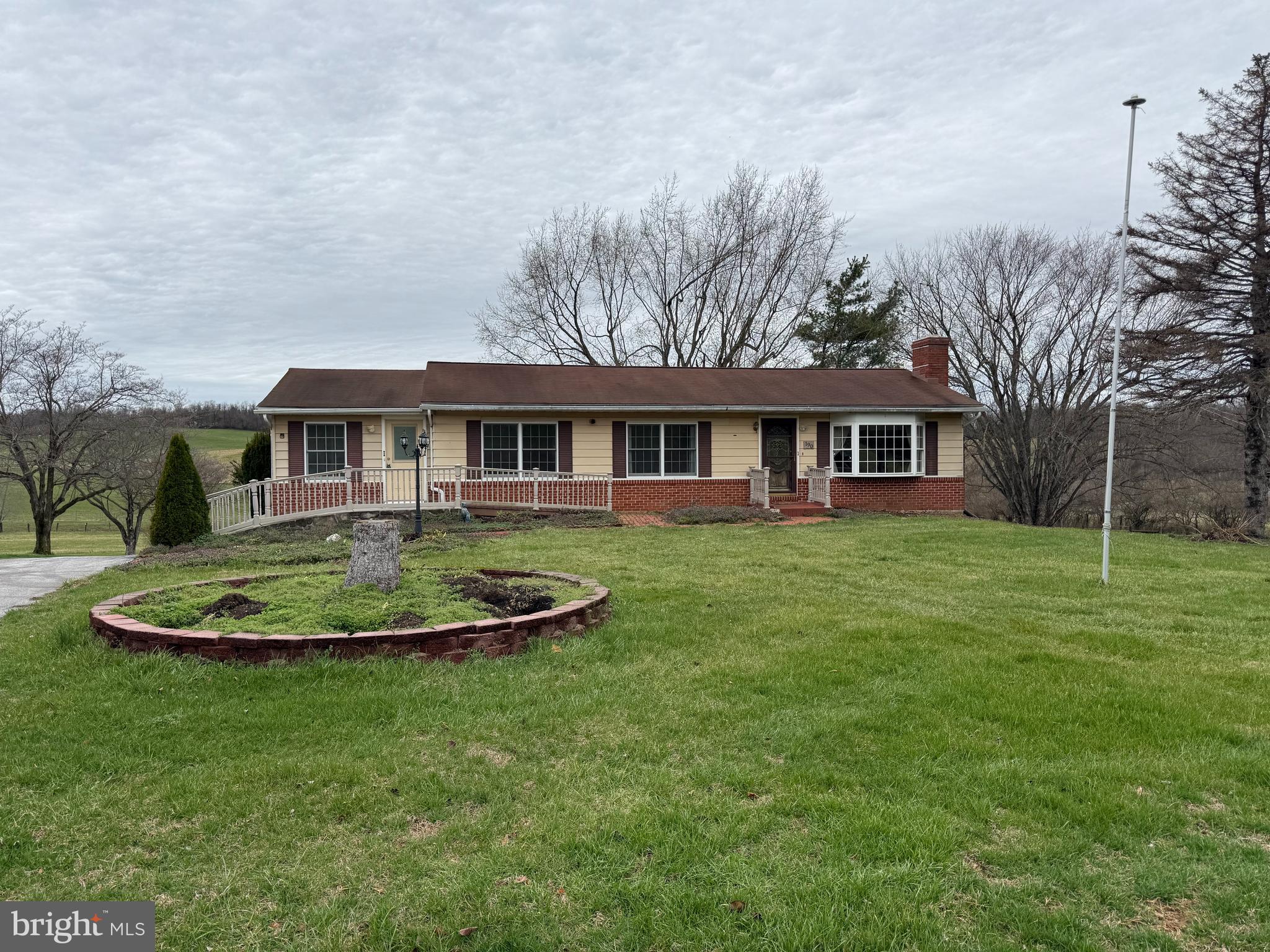 190 Bachmans Valley Road Westminster, MD 21158 - Photo 3 of 33 a front view of a house with a yard table and chairs