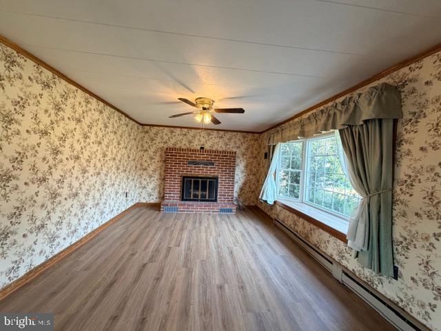 190 Bachmans Valley Road Westminster, MD 21158 - Photo 8 of 33 a view of empty room with wooden floor and fireplace