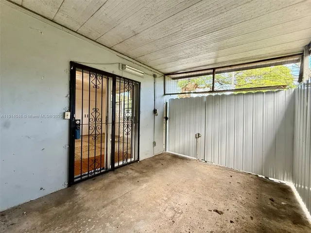 a view of a backyard with plants and a backyard