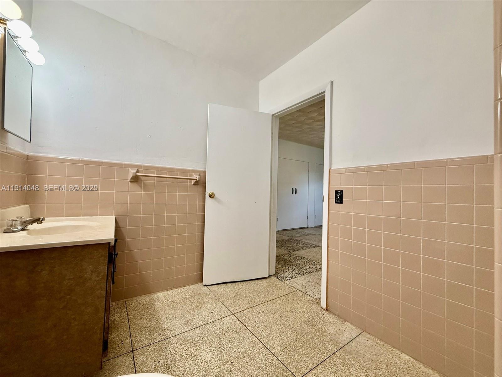 3000 Northwest 5th Street Miami, FL 33125 - Photo 31 of 54 a bathroom with a sink and a shower