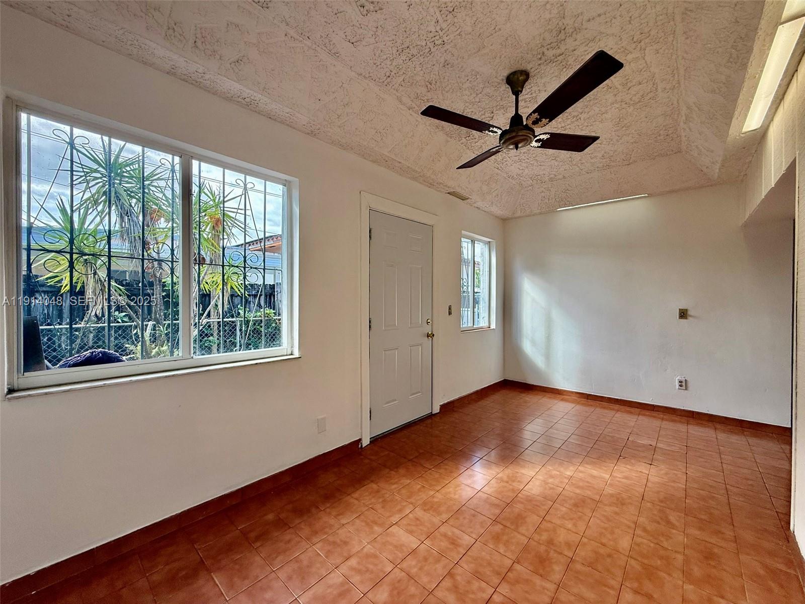 3000 Northwest 5th Street Miami, FL 33125 - Photo 35 of 54 a view of empty room with wooden floor and fan