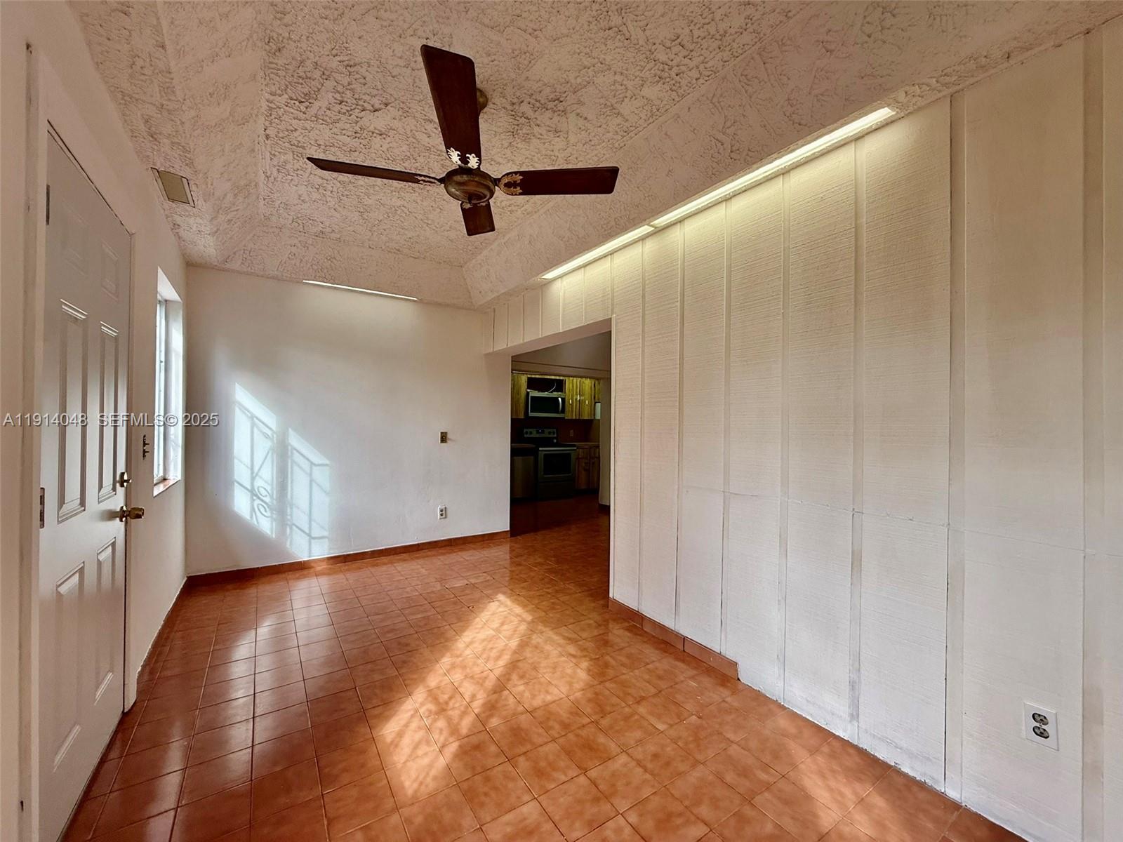 3000 Northwest 5th Street Miami, FL 33125 - Photo 36 of 54 a view of a livingroom with a ceiling fan and wooden floor