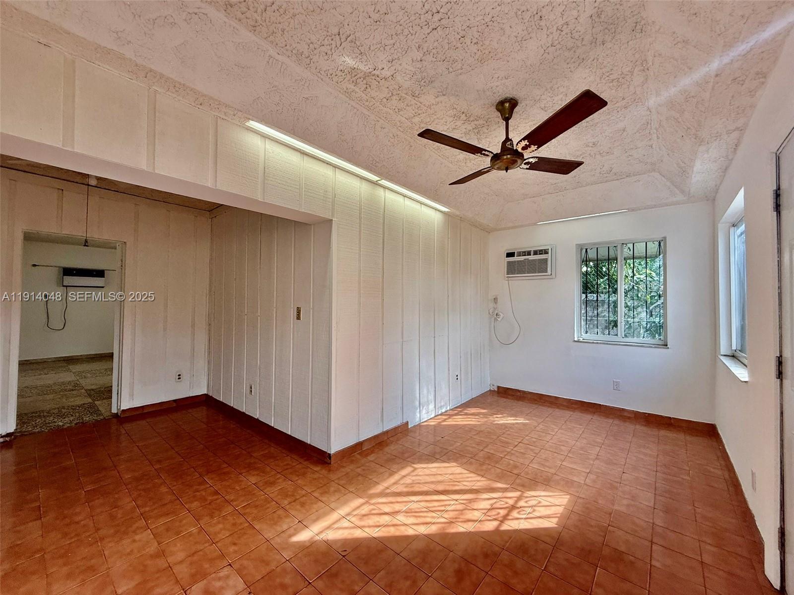 3000 Northwest 5th Street Miami, FL 33125 - Photo 37 of 54 a view of a livingroom with a ceiling fan and window