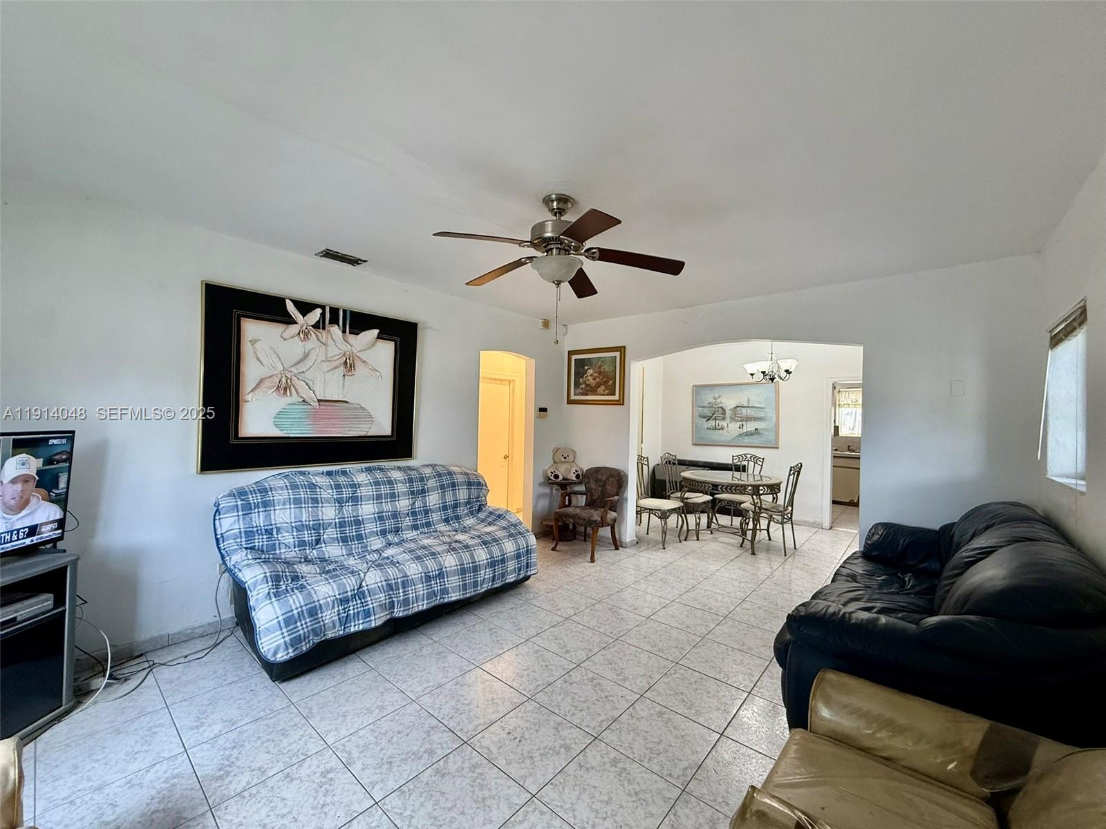 3000 Northwest 5th Street Miami, FL 33125 - Photo 4 of 54 a bedroom with furniture and a window