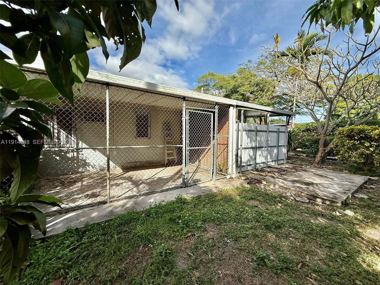 3000 Northwest 5th Street Miami, FL 33125 - Photo 48 of 54 a backyard of a house with table and chairs