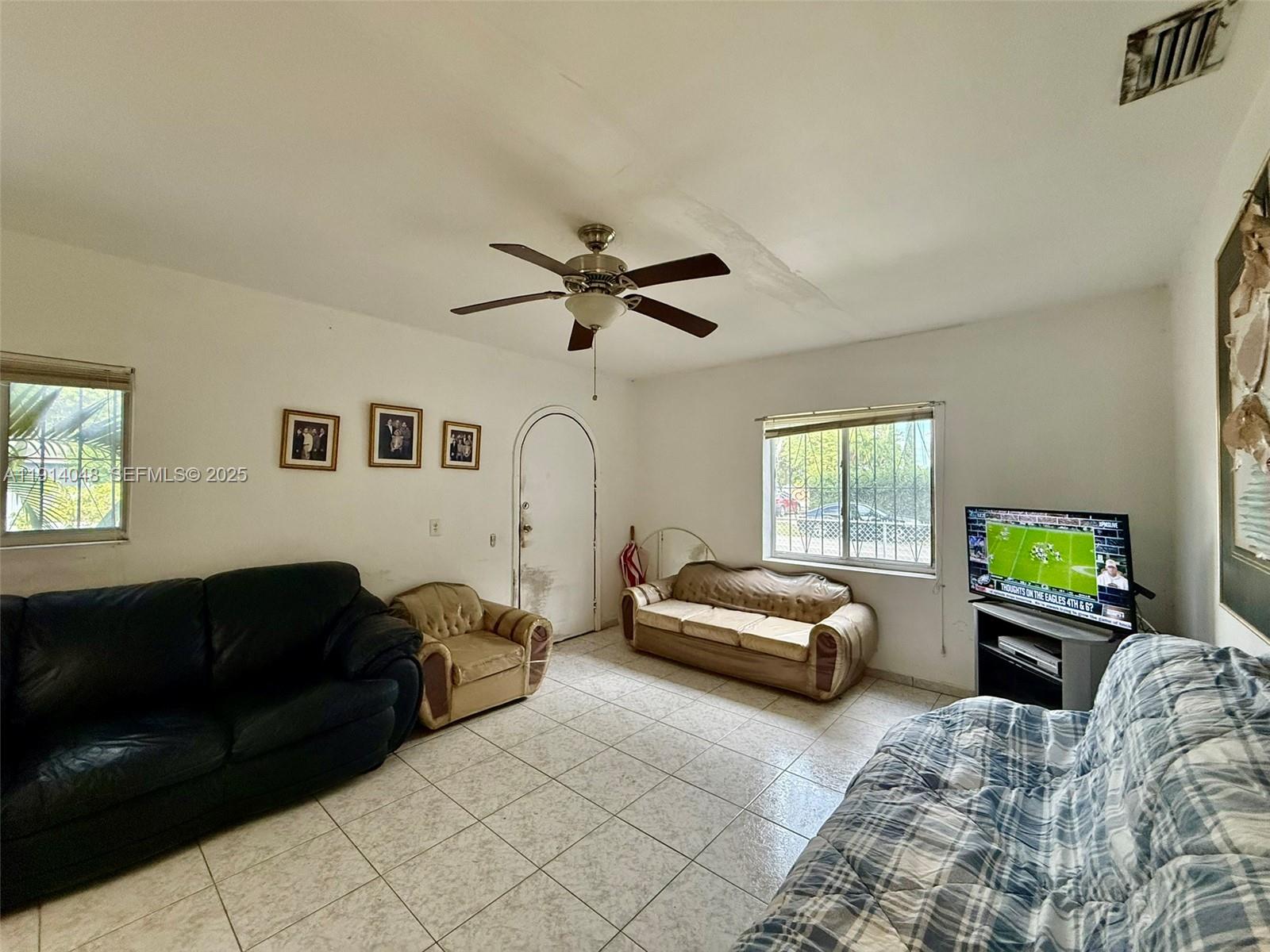 3000 Northwest 5th Street Miami, FL 33125 - Photo 5 of 54 a living room with furniture and a window