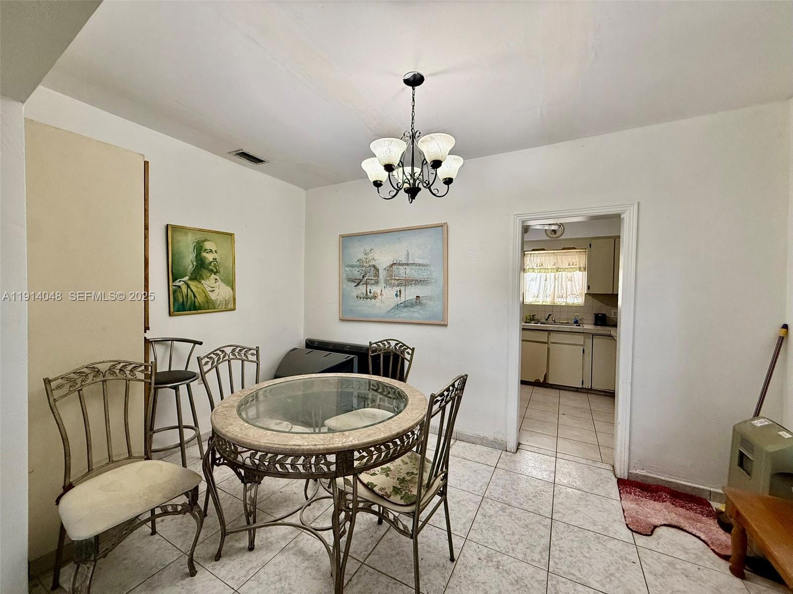 3000 Northwest 5th Street Miami, FL 33125 - Photo 6 of 54 a dining room with furniture and window