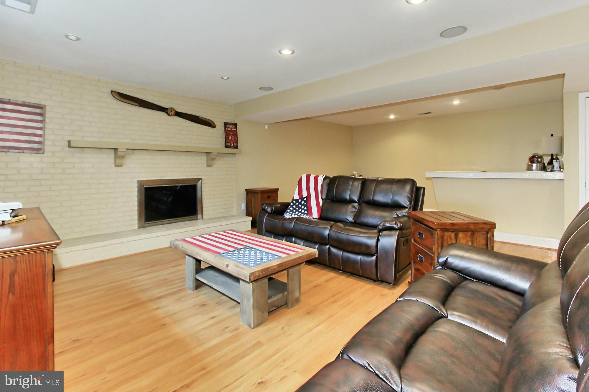 7376 Clifton Road Clifton, VA 20124 - Photo 17 of 25 Lower Level with fireplace