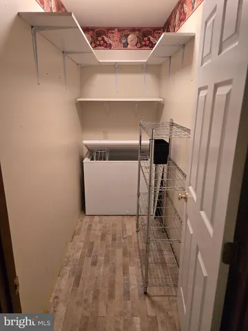 a view of staircase with white walls