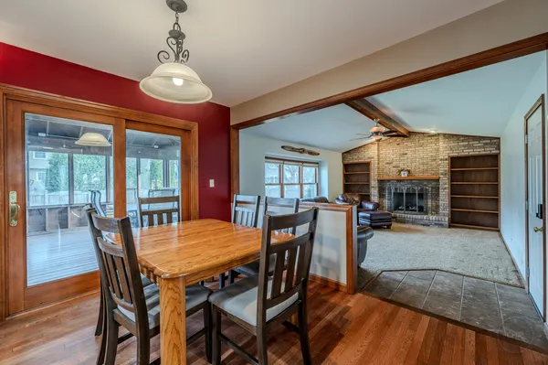 a dining room with a table chairs and entryway