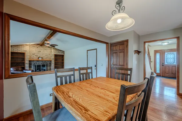 a kitchen with stainless steel appliances granite countertop a sink a stove and a refrigerator