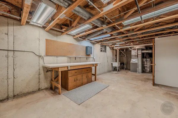 a dining room with furniture wooden floor and a rug
