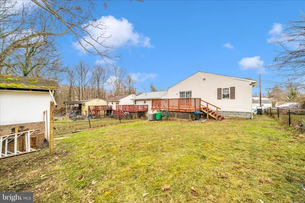 a front view of a house with a yard table and chairs