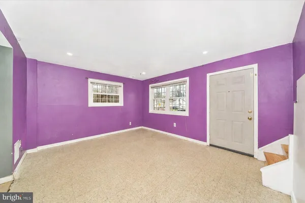 a empty room with windows