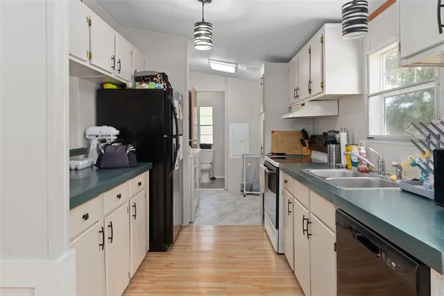 a kitchen with kitchen island granite countertop lots of counter top space and appliances