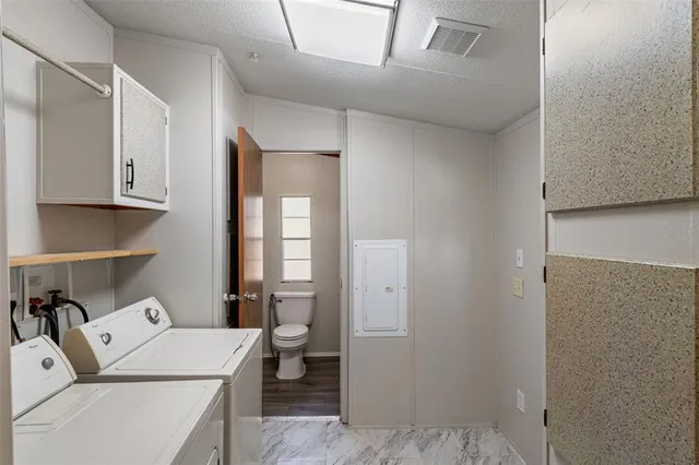 a room with a bed and cabinets