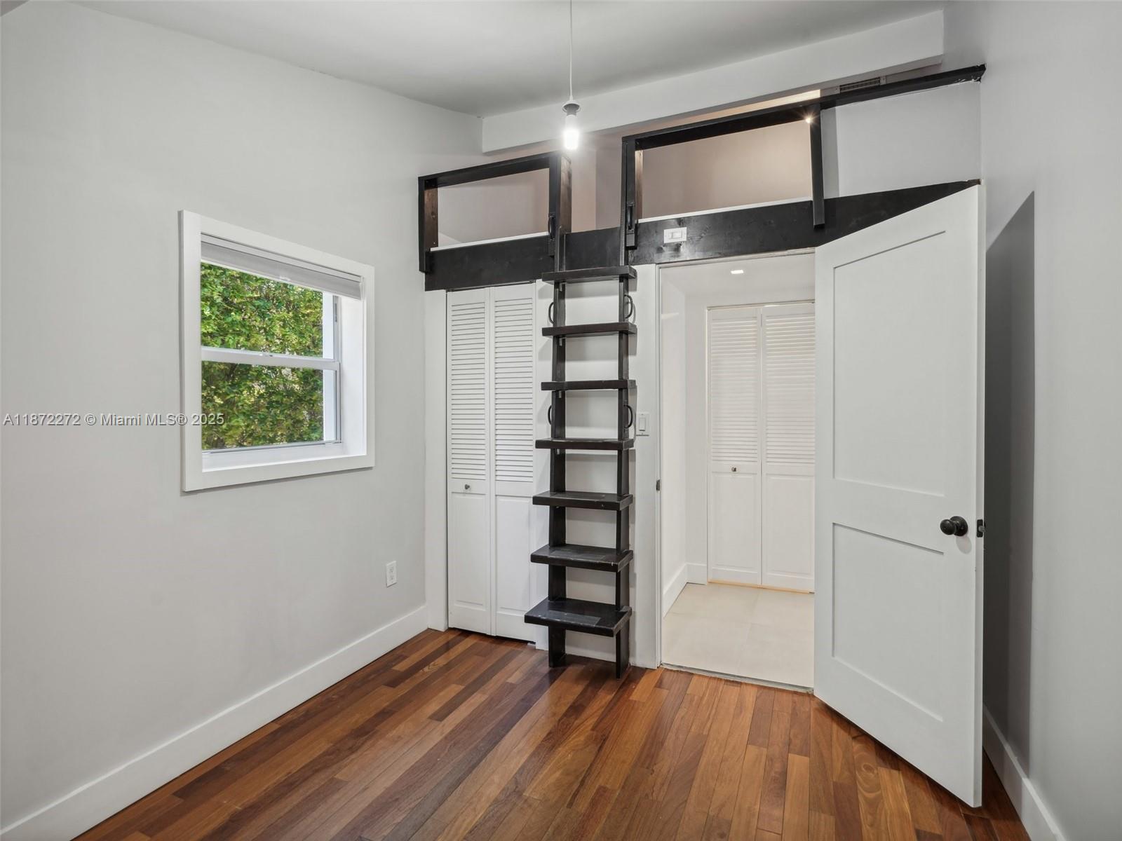8875 Abbott Avenue Surfside, FL 33154 - Photo 15 of 45 a view of a hallway with wooden floor and entryway