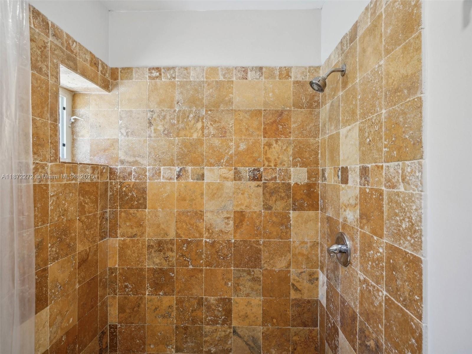 8875 Abbott Avenue Surfside, FL 33154 - Photo 22 of 45 a bathroom with a shower