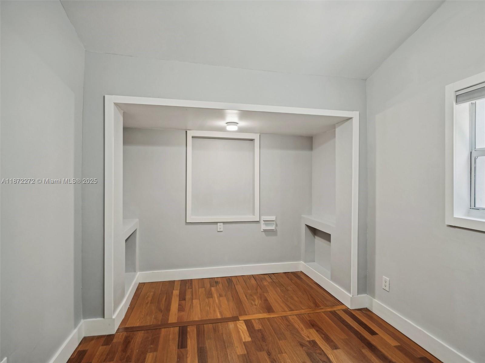8875 Abbott Avenue Surfside, FL 33154 - Photo 24 of 45 a view of a room with wooden floor and white walls