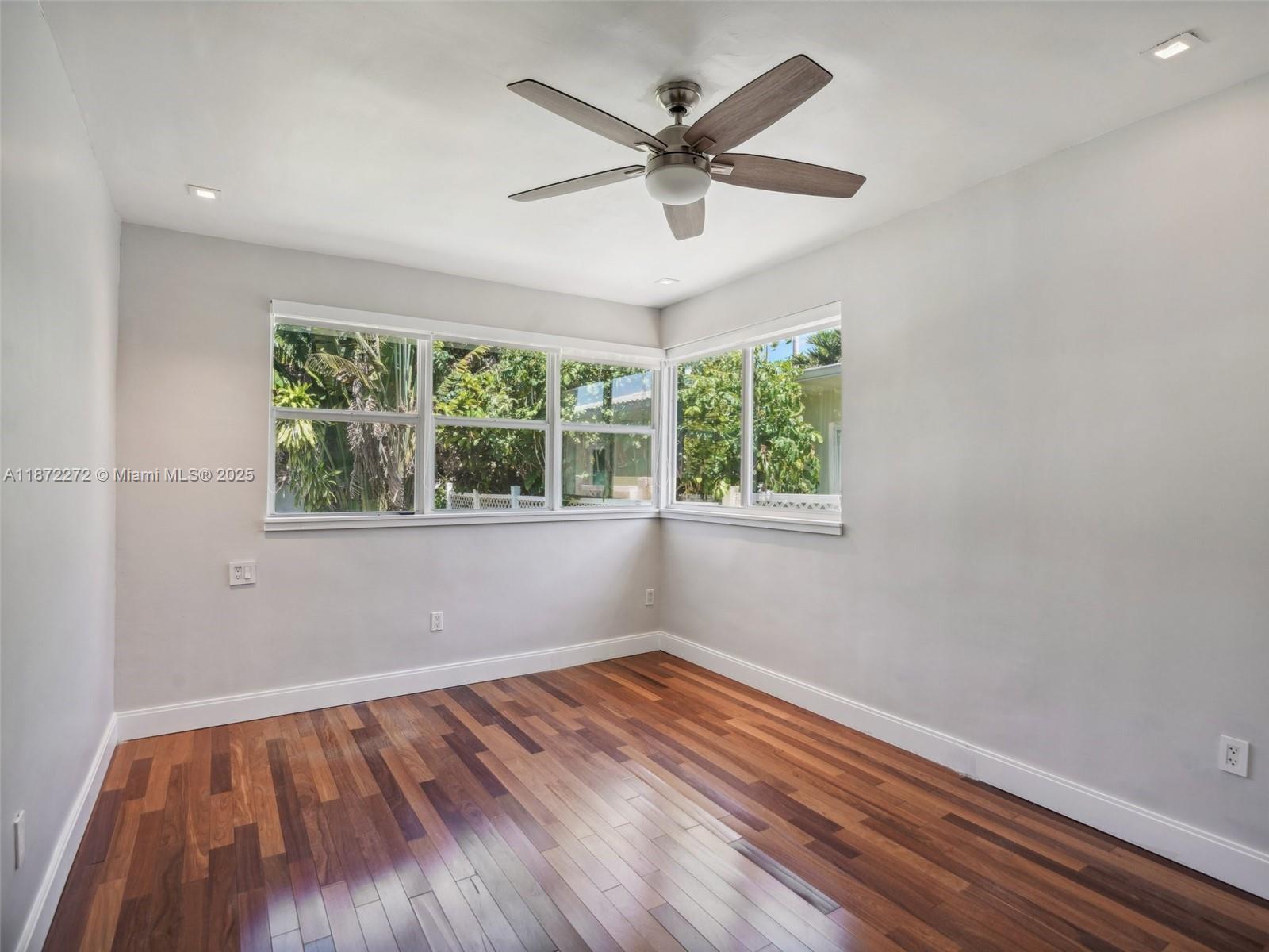 8875 Abbott Avenue Surfside, FL 33154 - Photo 25 of 45 wooden floor in an empty room with a window