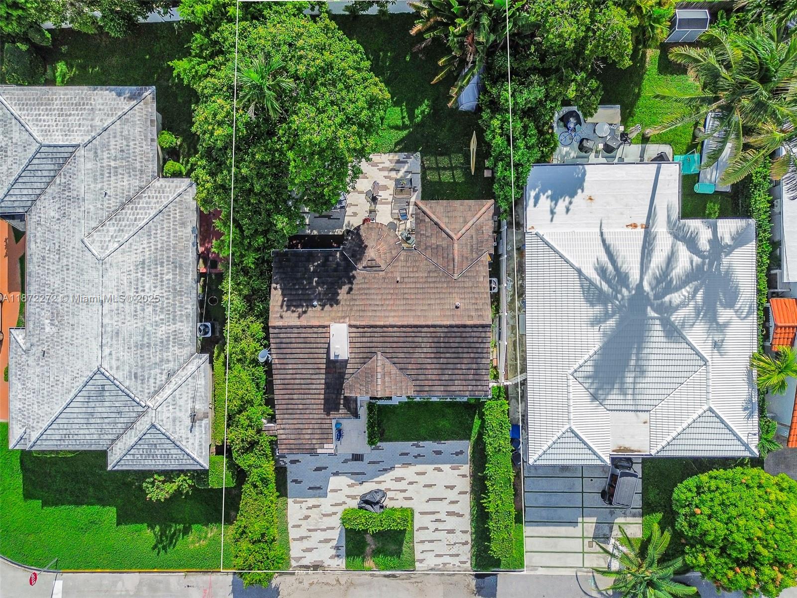 8875 Abbott Avenue Surfside, FL 33154 - Photo 35 of 45 an aerial view of a house with garden space and street view