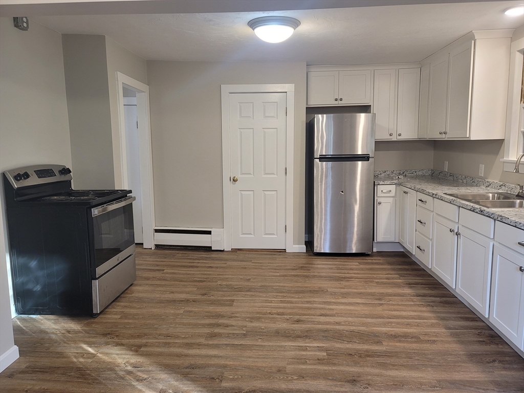 45 Main Street, Unit I Charlton, MA 01507 - Photo 2 of 11 a view of a kitchen with electric appliances